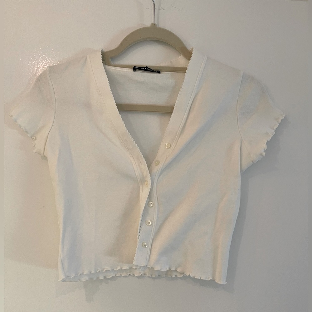 Brandy Melville Button-Up Short Sleeve Top with Ruffled Sleeve Ends and Hem.